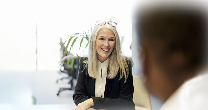 Businesswoman seated across from client