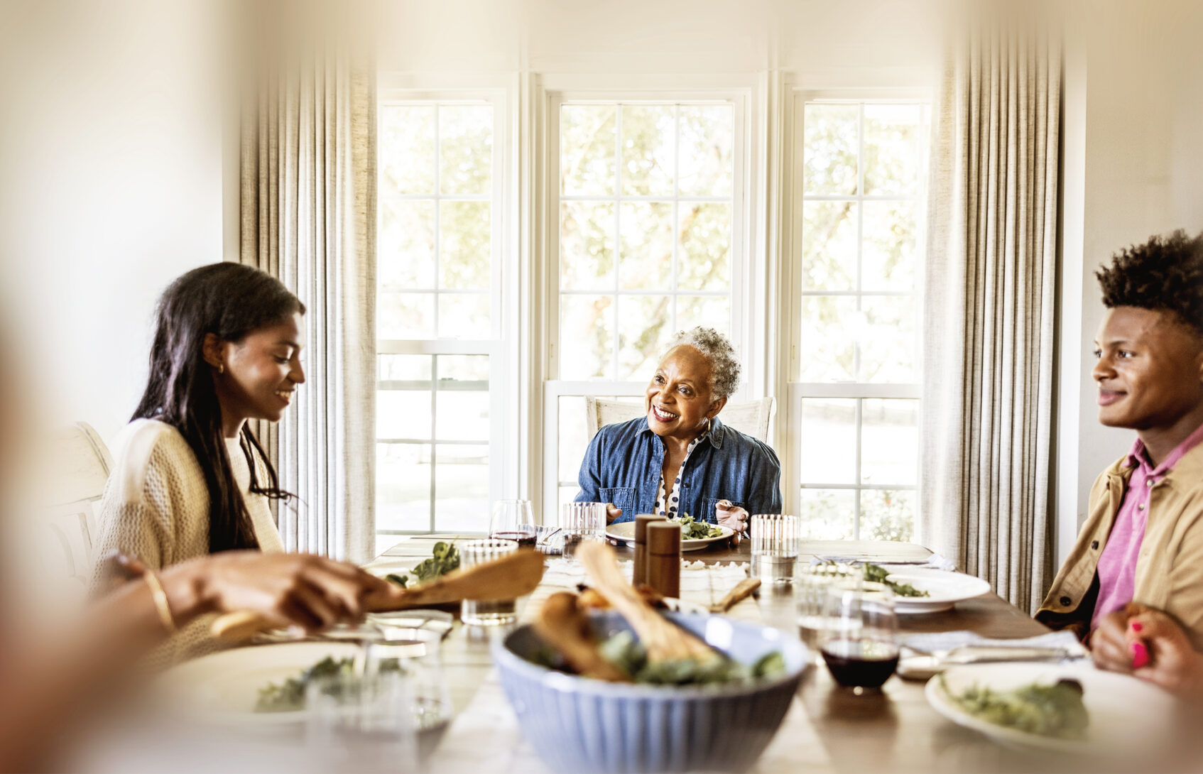 Multigenerational family having dinner.