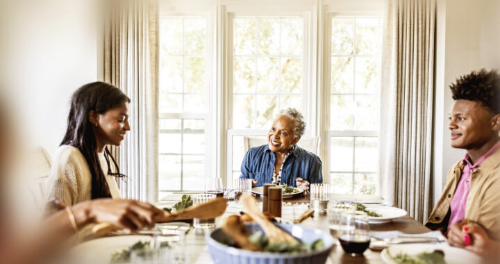 Multigenerational family having dinner.