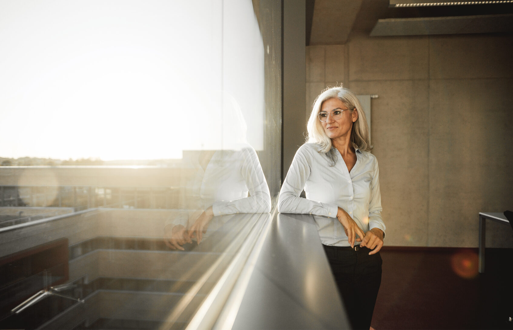 A businesswoman looking out the window.